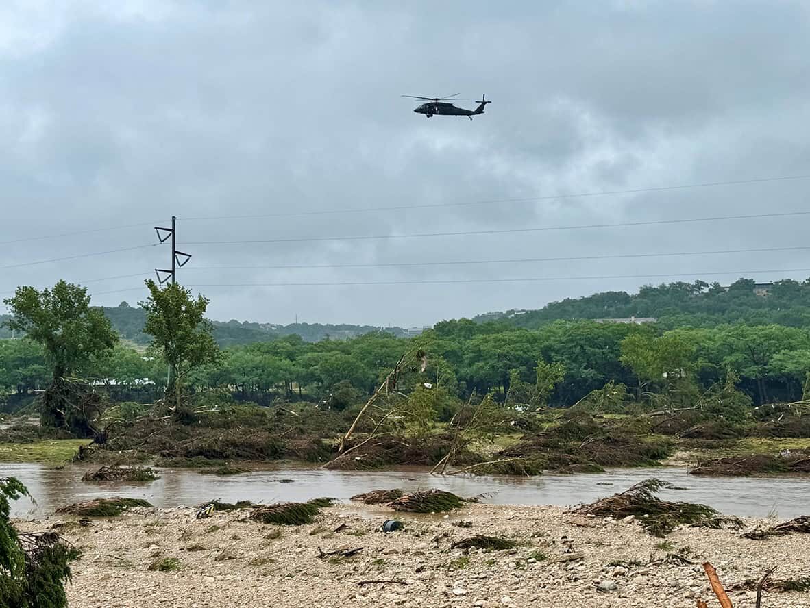 helicopter flying over the flood damage in hunt, texas